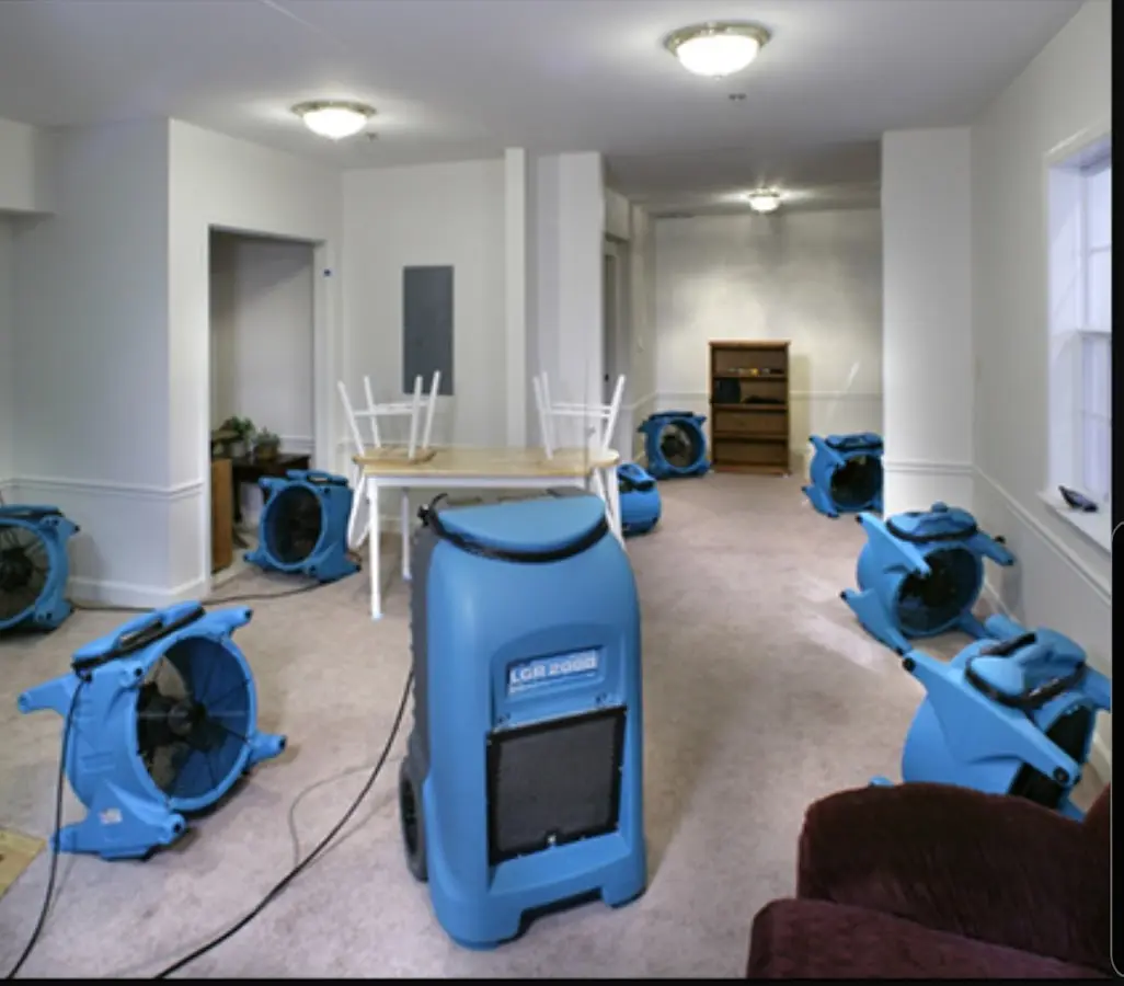 Air movers and dehumidifier setup for Water Damage Restoration in Enoch