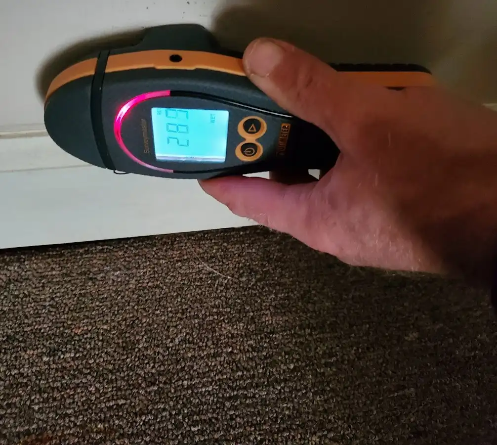 Moisture detection at baseboard during Storm Damage Restoration in Enoch